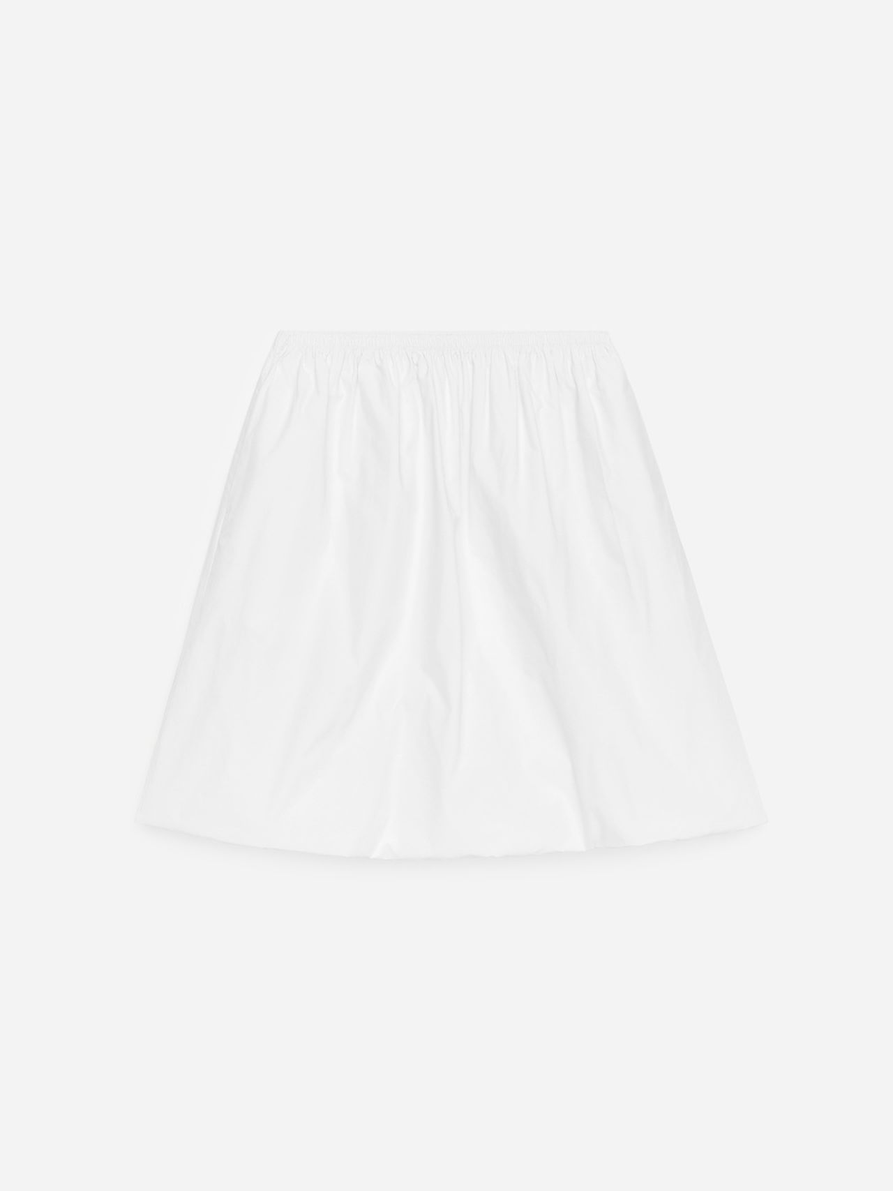White, knee-length skirt with an elastic waistband and a slightly flared silhouette, set against a plain background.
