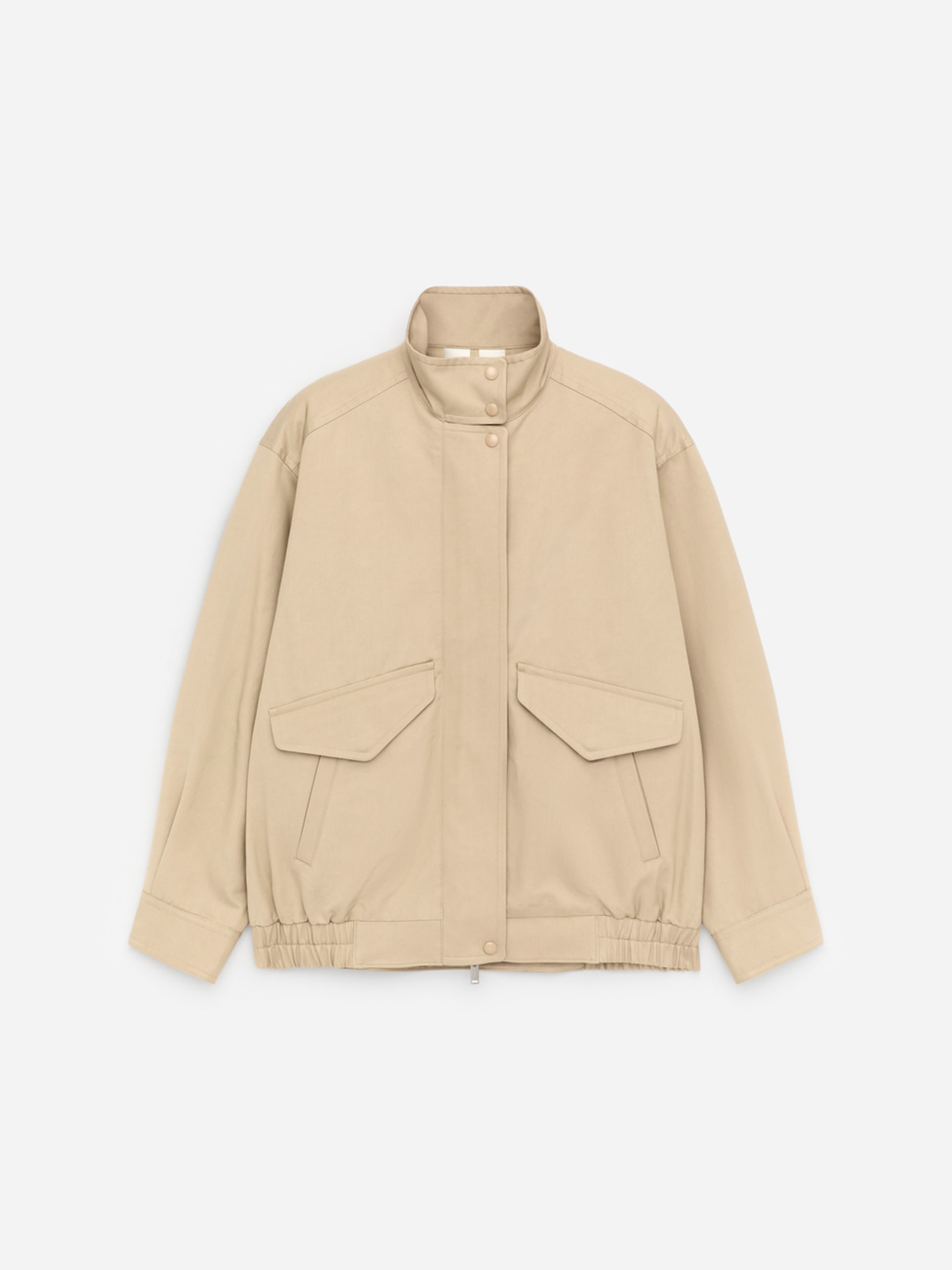 Beige jacket with a high collar, long sleeves, front zipper, button closure, and two large flap pockets, against a white background.