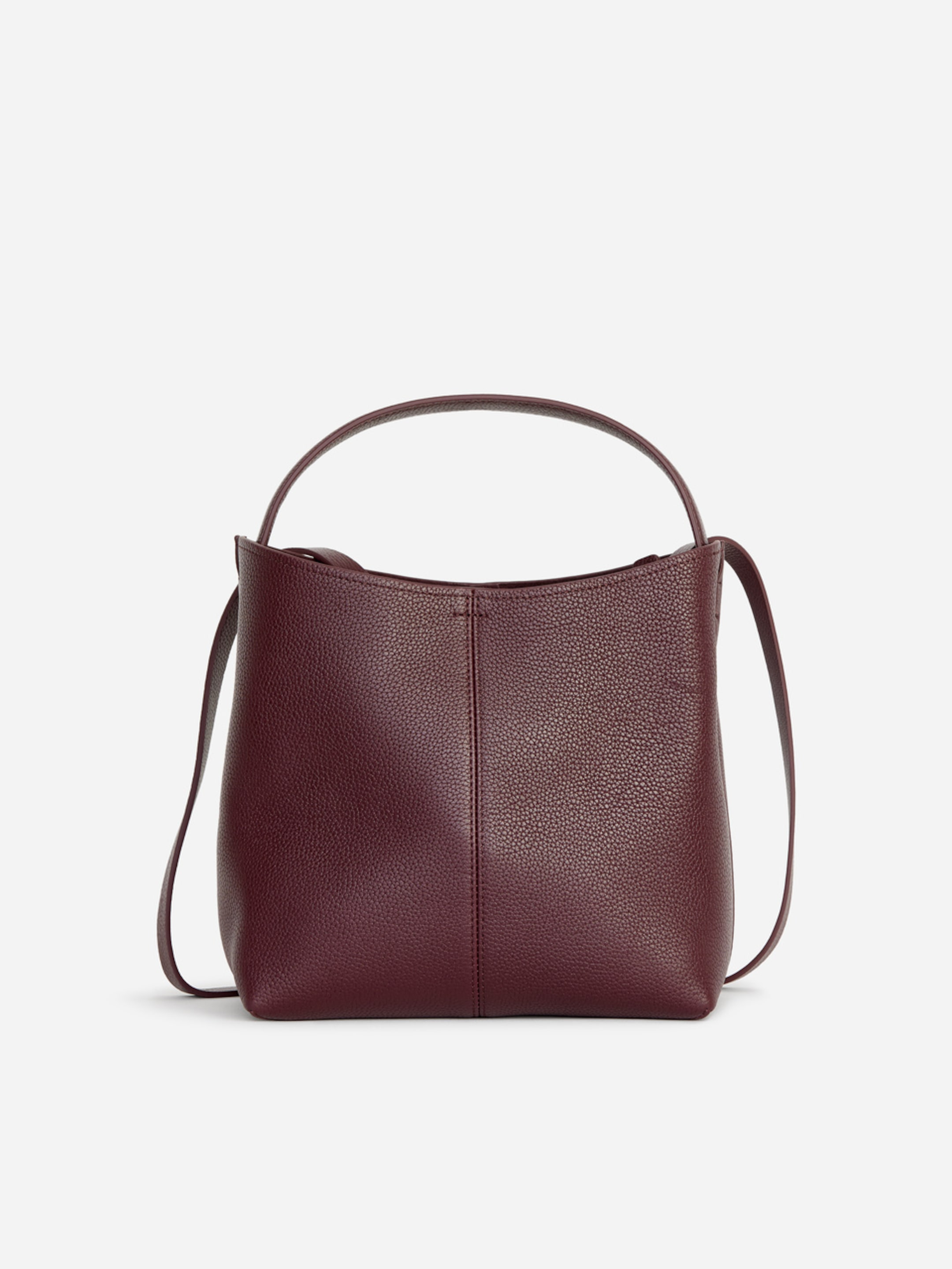 A deep burgundy leather tote bag with a structured shape, featuring a simple handle and an adjustable shoulder strap, set against a plain white background.