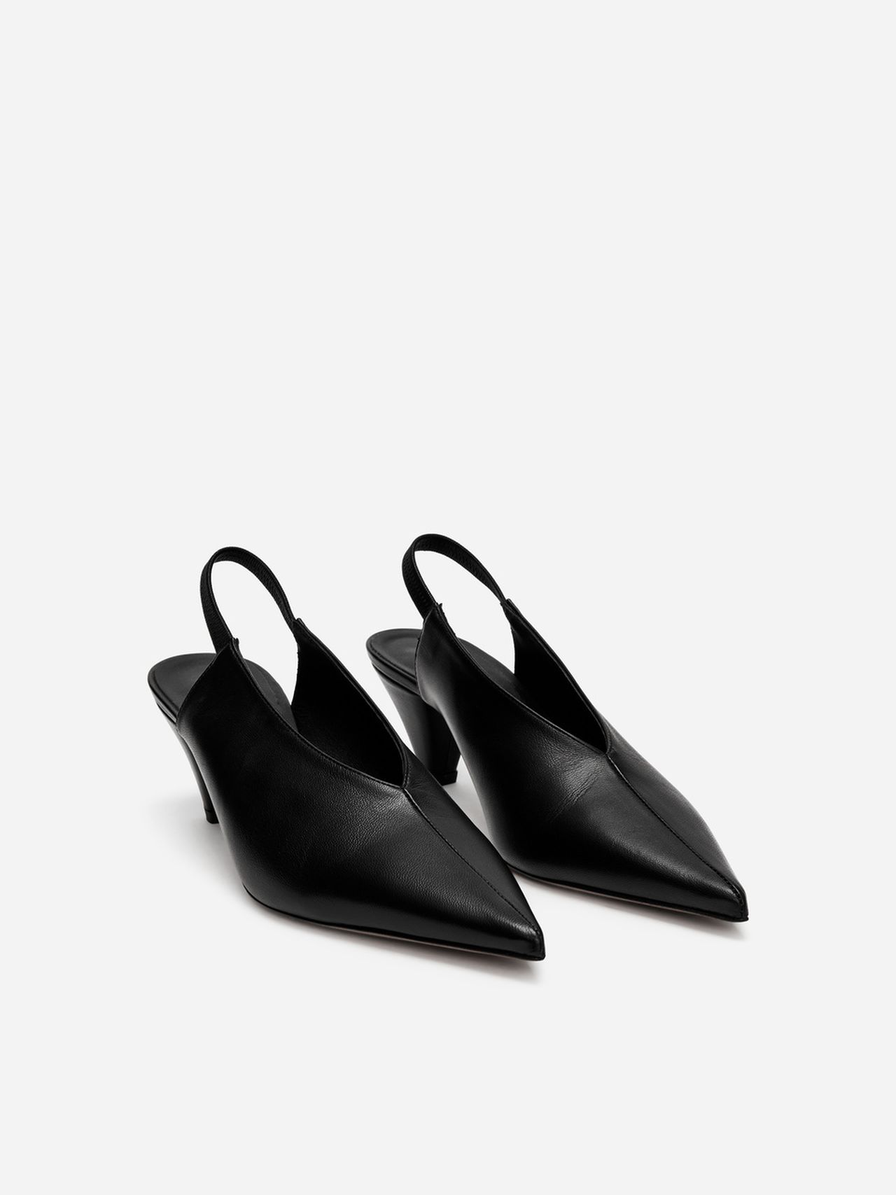 Black leather slingback pumps with pointed toes and mid-height heels on a plain white background.