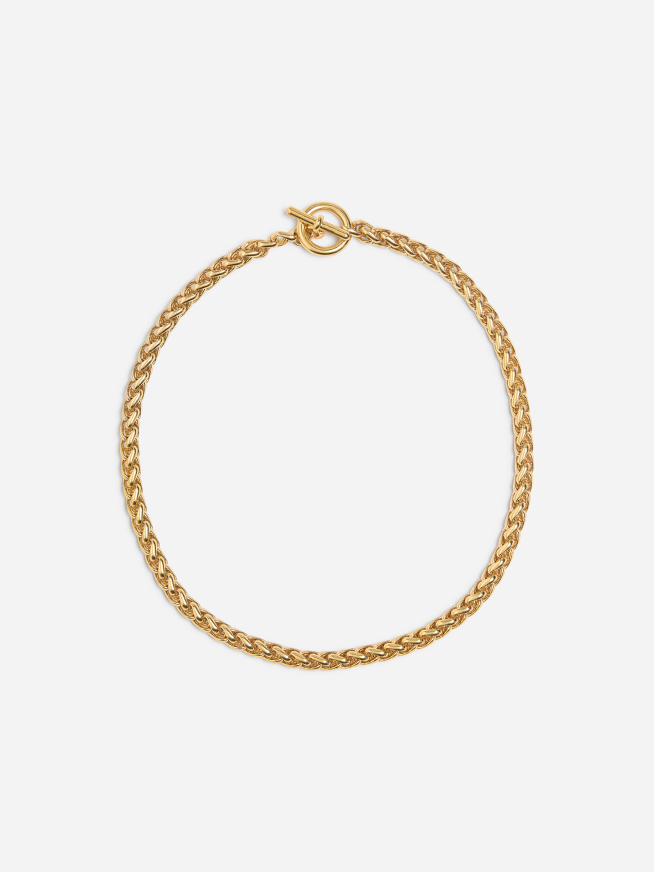 A gold chain necklace with a braided design and a toggle clasp, elegantly arranged in a circle on a plain white background.
