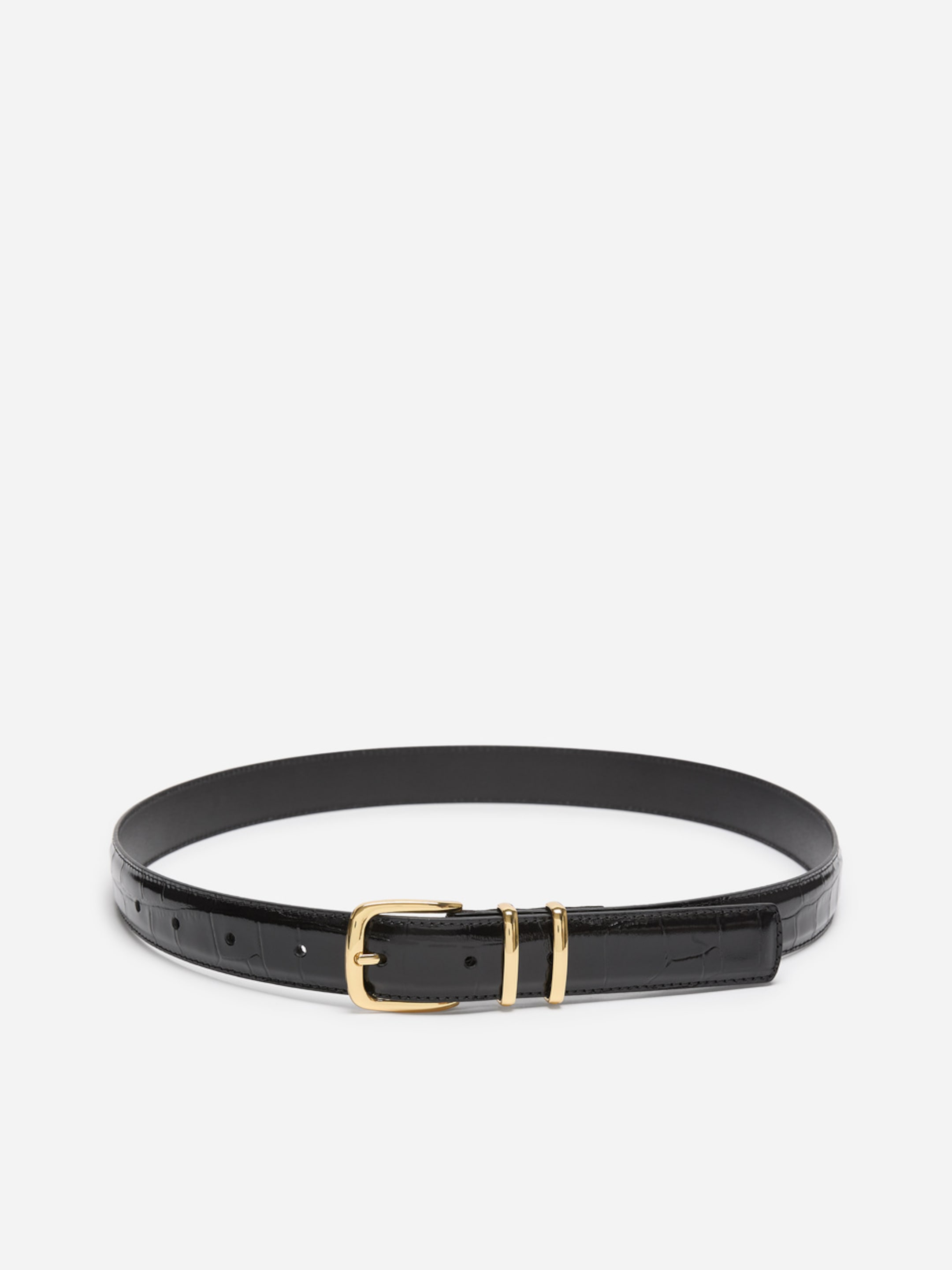 Black leather belt with a gold buckle and double loops, featuring a subtle crocodile pattern, laid flat on a white surface.