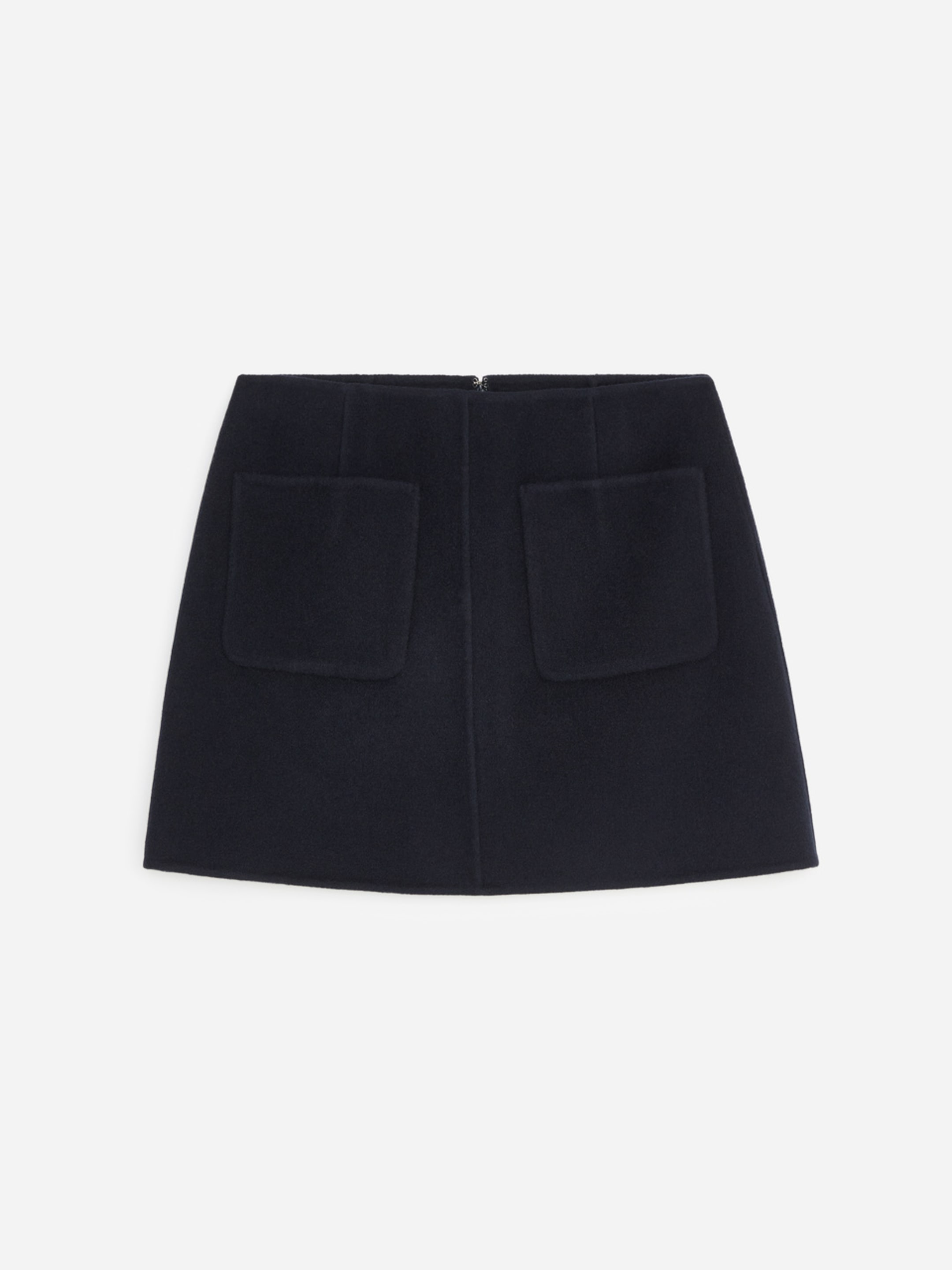 A black wool mini skirt with two front pockets, set against a plain white background.