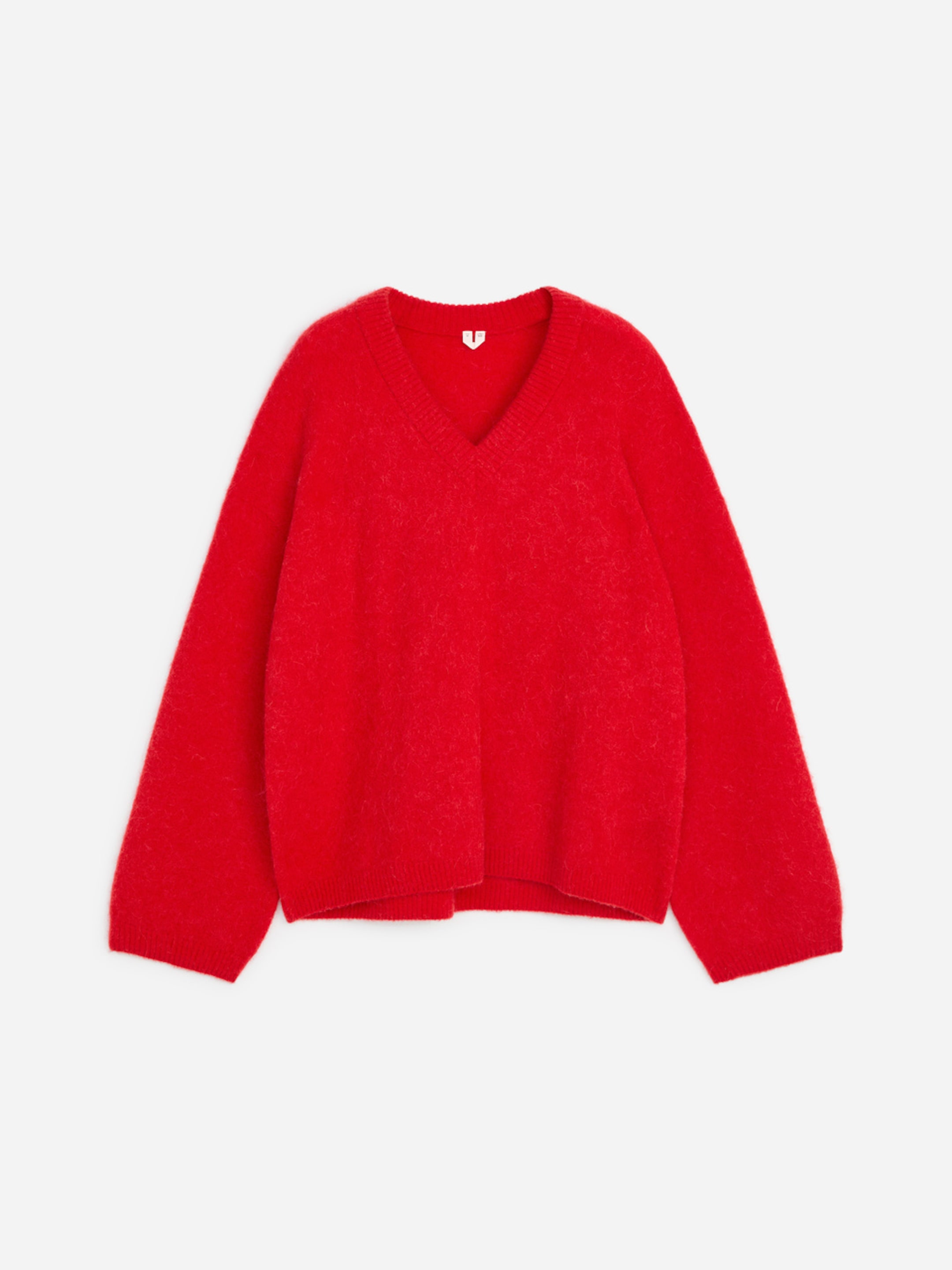 Red V-neck sweater with long sleeves, made of soft, fuzzy material, isolated on a white background.