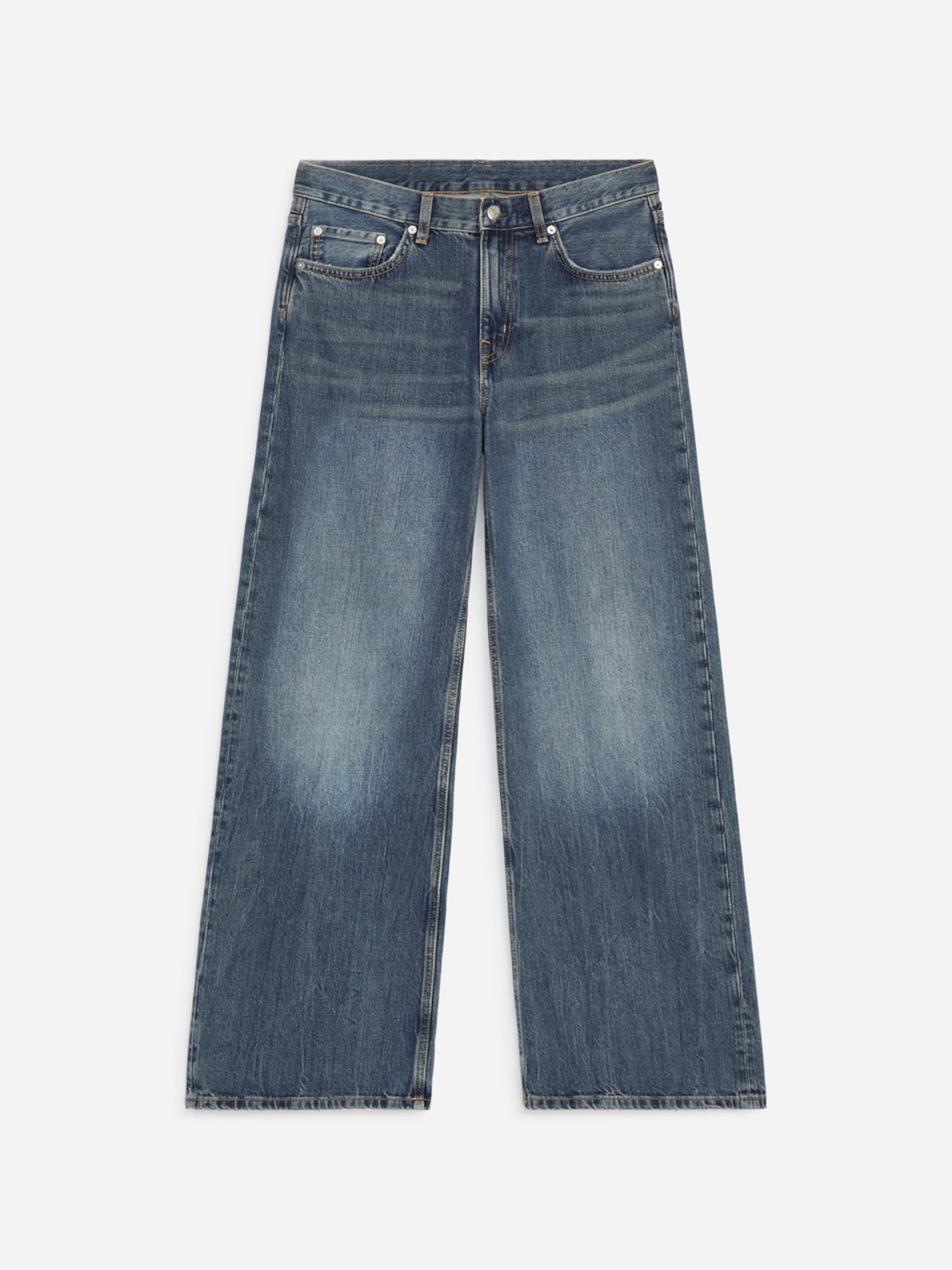 Blue wide-leg jeans with a faded finish, featuring a button and zipper closure, front pockets, and belt loops, laid flat on a white background.