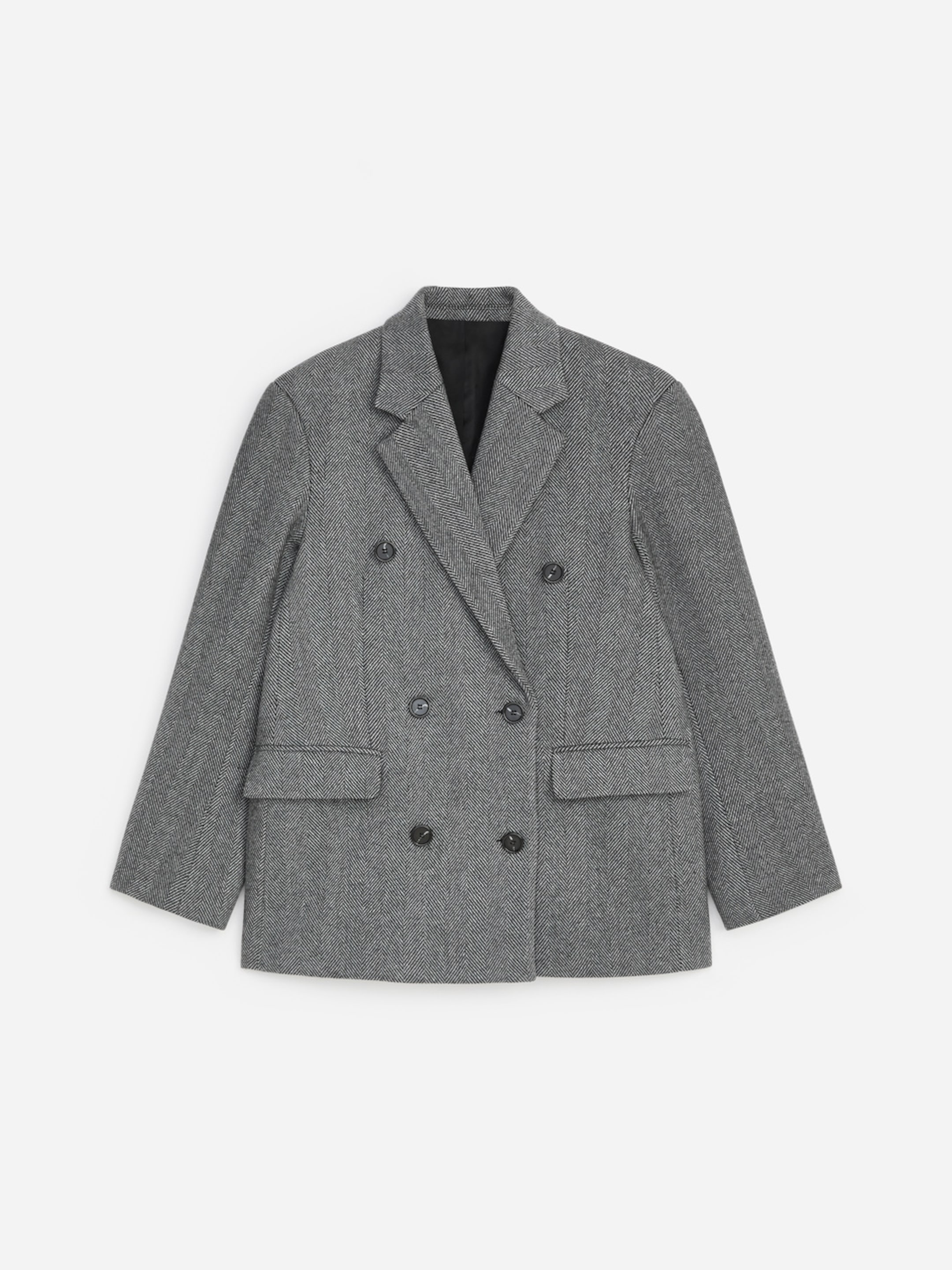 Gray herringbone double-breasted blazer with black buttons and two front pockets, laid flat on a white background.