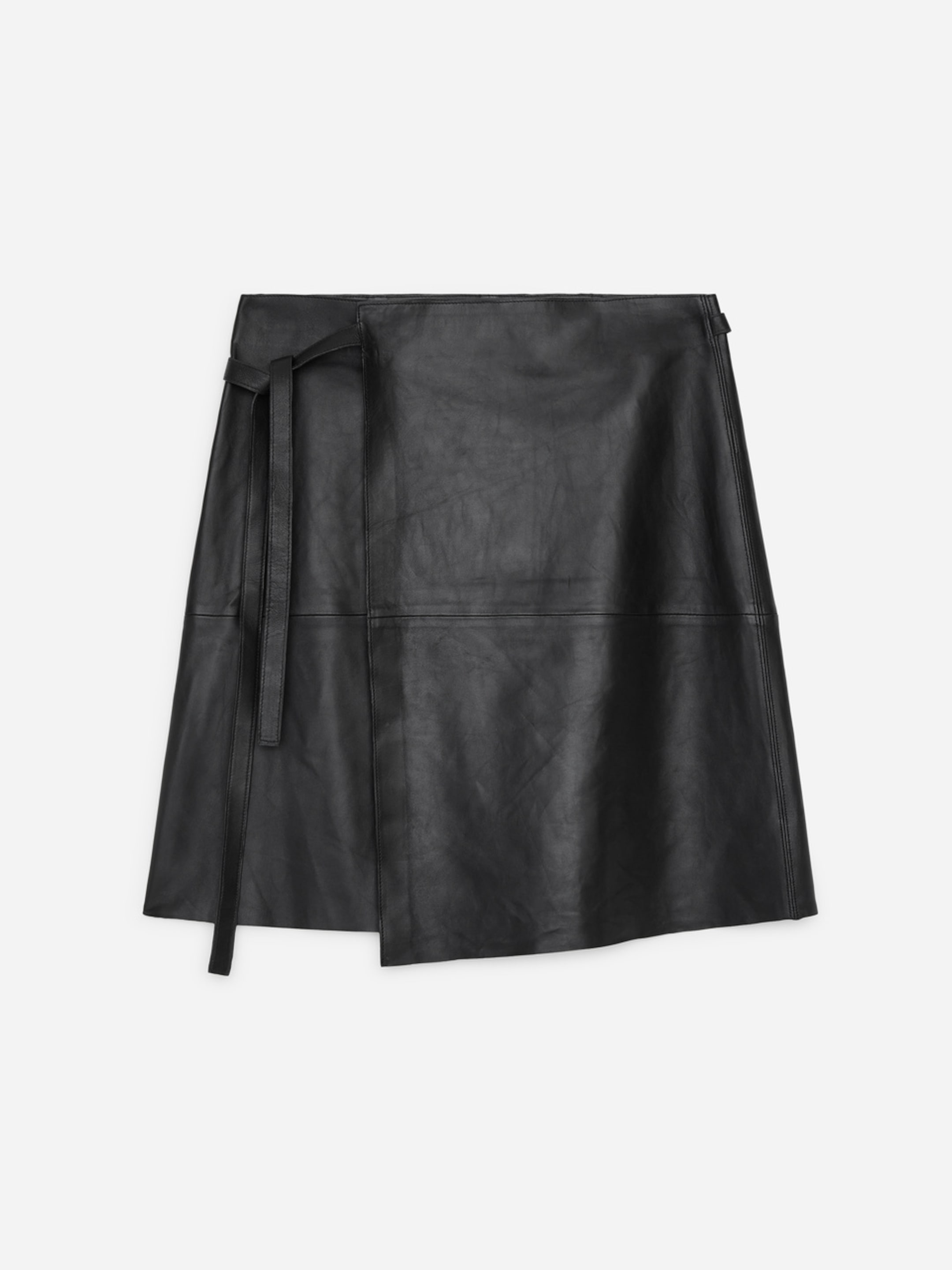 Black faux leather wrap skirt with a tie closure on the left side, featuring a simple and modern design.